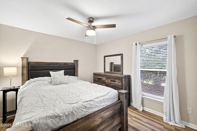 8523 Hampton Landing Dr, Jacksonville, FL 32256 - bedroom with light wood finished floors and ceiling fan