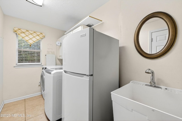 8523 Hampton Landing Dr, Jacksonville, FL 32256 - laundry room with light tile patterned floors and independent washer and dryer