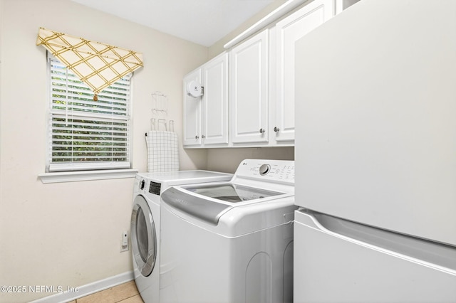 8523 Hampton Landing Dr, Jacksonville, FL 32256 - laundry area with independent washer and dryer, cabinet space, and light tile patterned floors