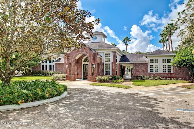 8523 Hampton Landing Dr, Jacksonville, FL 32256 - view of front of property featuring brick siding and a front lawn