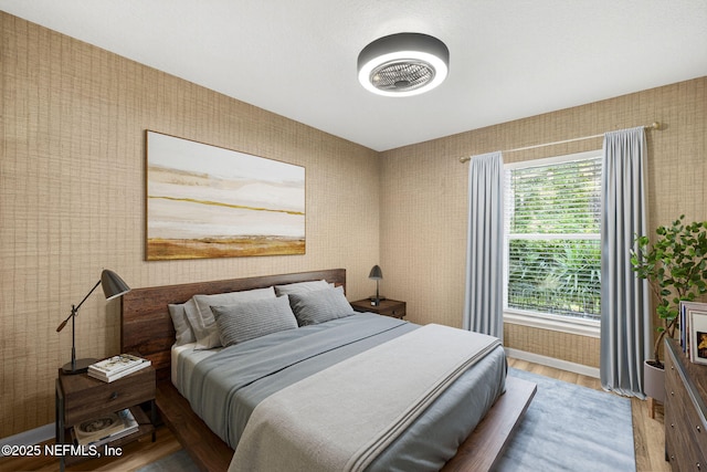 8523 Hampton Landing Dr, Jacksonville, FL 32256 - bedroom with wood finished floors and wallpapered walls