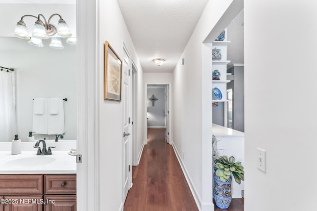 13707 Alesbury Ct, Jacksonville, FL 32224 - corridor with dark wood-style flooring and a textured ceiling