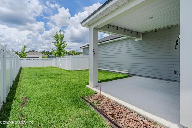 575 Buttonwood Loop, Yulee, FL 32097 - fenced backyard with a patio