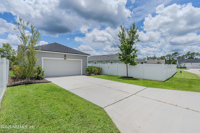 575 Buttonwood Loop, Yulee, FL 32097 - view of yard with concrete driveway and a garage