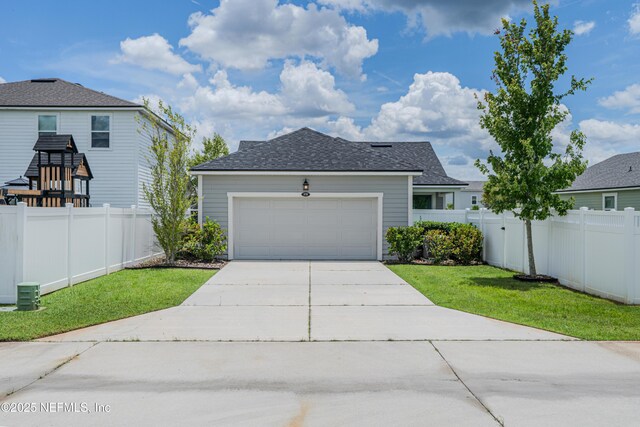 575 Buttonwood Loop, Yulee, FL 32097 - view of front facade with driveway, a shingled roof, and a garage