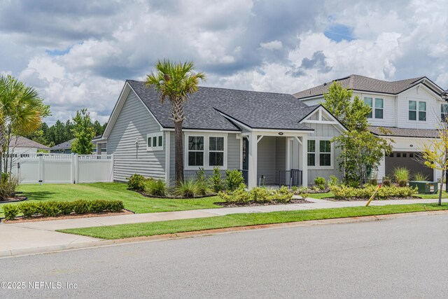 575 Buttonwood Loop, Yulee, FL 32097 - view of front facade with a shingled roof and board and batten siding