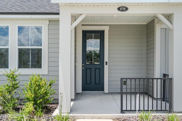 575 Buttonwood Loop, Yulee, FL 32097 - entrance to property with a porch and a shingled roof