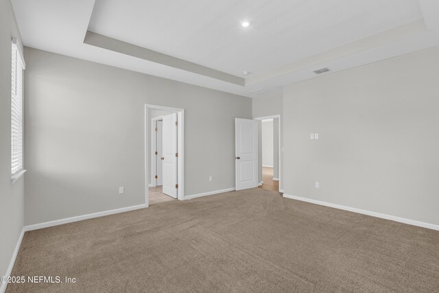 575 Buttonwood Loop, Yulee, FL 32097 - unfurnished bedroom featuring a raised ceiling, carpet, and recessed lighting