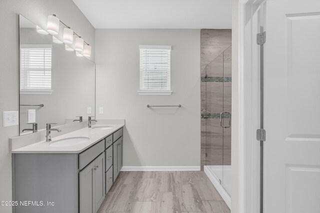 575 Buttonwood Loop, Yulee, FL 32097 - bathroom featuring healthy amount of natural light, double vanity, and a stall shower