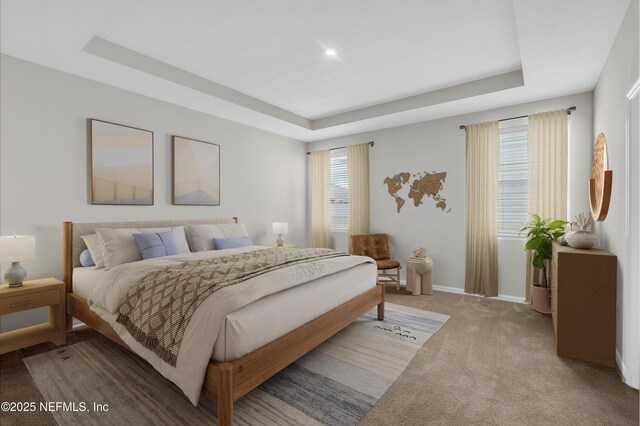 575 Buttonwood Loop, Yulee, FL 32097 - carpeted bedroom with a tray ceiling and baseboards