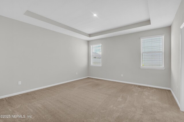 575 Buttonwood Loop, Yulee, FL 32097 - empty room with a raised ceiling and light colored carpet