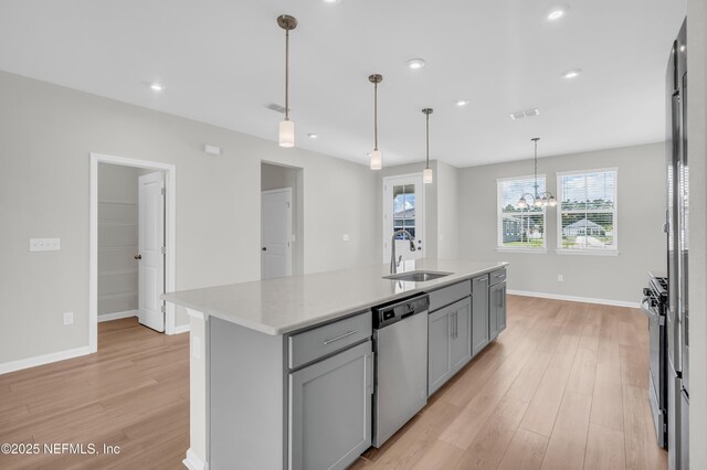 575 Buttonwood Loop, Yulee, FL 32097 - kitchen featuring appliances with stainless steel finishes, gray cabinets, light wood finished floors, light countertops, and recessed lighting