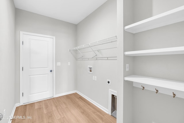 575 Buttonwood Loop, Yulee, FL 32097 - washroom with hookup for a washing machine, hookup for an electric dryer, and light wood-style flooring