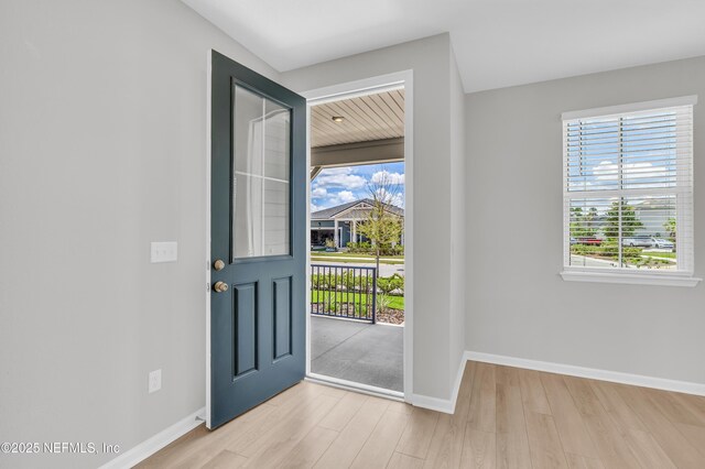 575 Buttonwood Loop, Yulee, FL 32097 - foyer entrance featuring wood finished floors and baseboards