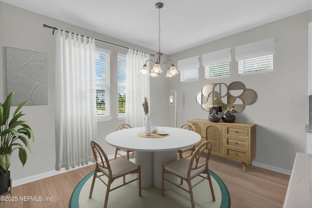 575 Buttonwood Loop, Yulee, FL 32097 - dining room with a chandelier and light wood-type flooring