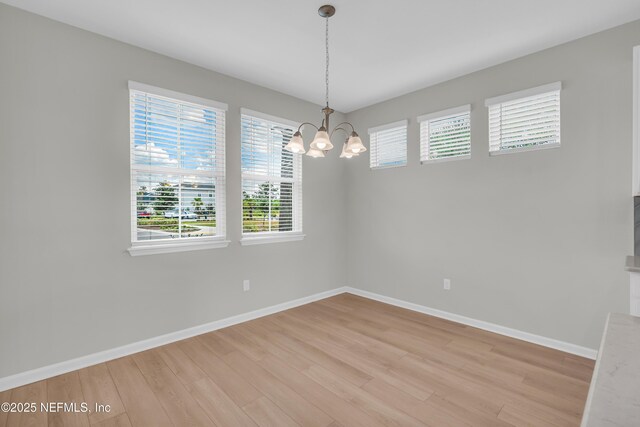 575 Buttonwood Loop, Yulee, FL 32097 - unfurnished room featuring a chandelier and light wood finished floors