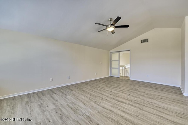 7728 Lynchburg Ct W, Jacksonville, FL 32277 - spare room featuring ceiling fan, light wood finished floors, and vaulted ceiling