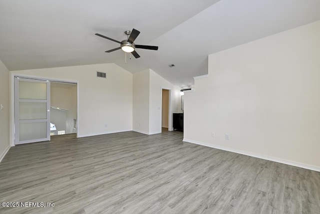 7728 Lynchburg Ct W, Jacksonville, FL 32277 - unfurnished living room featuring a ceiling fan, lofted ceiling, and wood finished floors