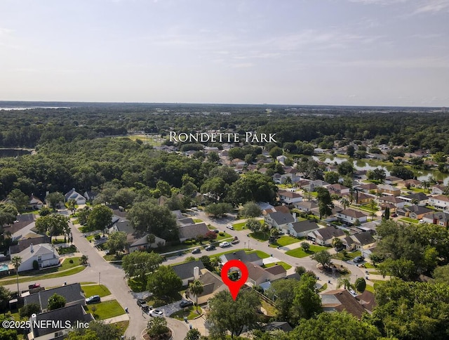7728 Lynchburg Ct W, Jacksonville, FL 32277 - aerial view of property and surrounding area with nearby suburban area and a forest
