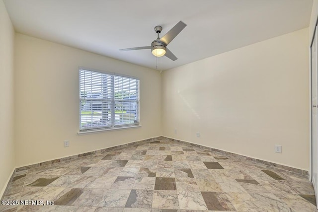 7728 Lynchburg Ct W, Jacksonville, FL 32277 - unfurnished room featuring ceiling fan and stone finish floors