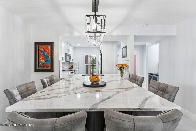 212 16th St Unit A, Saint Augustine Beach, FL 32080 - dining area with a chandelier