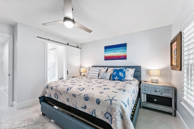 212 16th St Unit A, Saint Augustine Beach, FL 32080 - tiled bedroom featuring a barn door, multiple windows, a ceiling fan, and connected bathroom