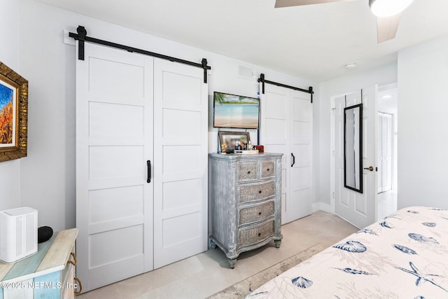 212 16th St Unit A, Saint Augustine Beach, FL 32080 - bedroom featuring a barn door and a ceiling fan
