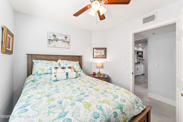 212 16th St Unit A, Saint Augustine Beach, FL 32080 - tiled bedroom with a ceiling fan and baseboards
