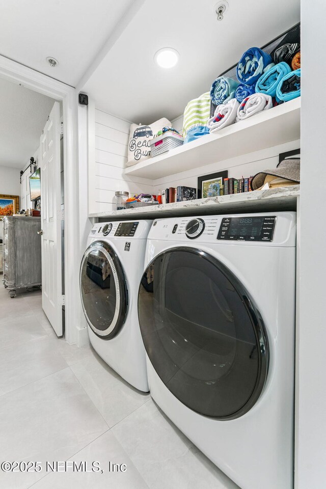 212 16th St Unit A, Saint Augustine Beach, FL 32080 - laundry room featuring independent washer and dryer and tile patterned flooring