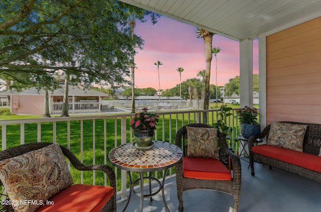 212 16th St Unit A, Saint Augustine Beach, FL 32080 - patio terrace at dusk with a porch