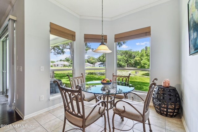 12569 Kernan Forest Blvd, Jacksonville, FL 32225 - dining area featuring crown molding, healthy amount of natural light, and light tile patterned floors