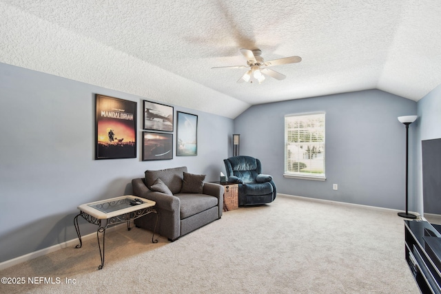 12569 Kernan Forest Blvd, Jacksonville, FL 32225 - sitting room featuring a ceiling fan, lofted ceiling, carpet floors, and a textured ceiling