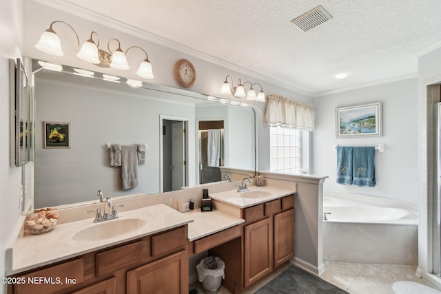 12569 Kernan Forest Blvd, Jacksonville, FL 32225 - full bathroom featuring double vanity, ornamental molding, a garden tub, a textured ceiling, and tile patterned flooring