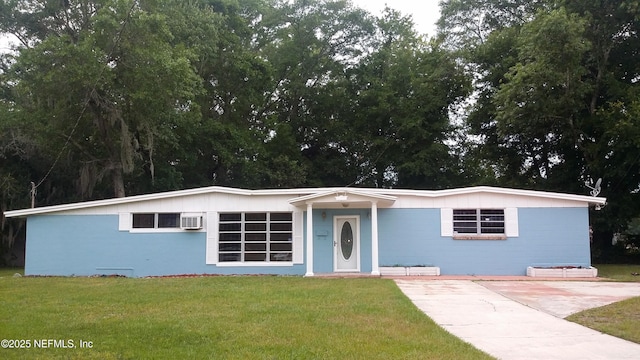 4872 Clyde Dr, Jacksonville, FL 32208 - view of front of house featuring a front lawn and a wall mounted AC