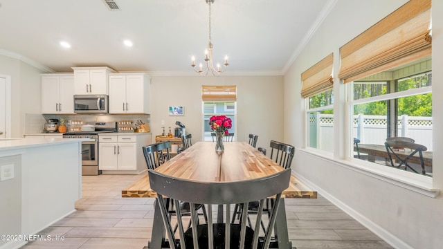 84 Granite City Ave, Saint Johns, FL 32259 - dining space with ornamental molding, a chandelier, light wood finished floors, and recessed lighting