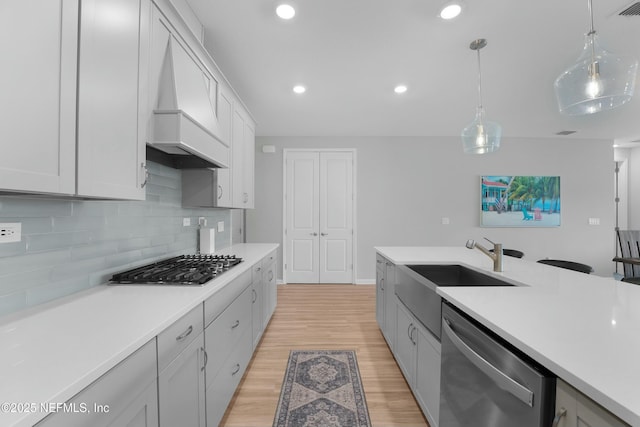 50 Skyline Ln, Saint Augustine, FL 32092 - kitchen with appliances with stainless steel finishes, premium range hood, light countertops, tasteful backsplash, and recessed lighting