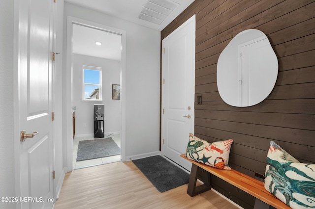 50 Skyline Ln, Saint Augustine, FL 32092 - entryway featuring wood walls and light wood-type flooring