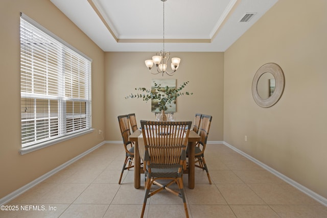 1100 Ashfield Way, Saint Johns, FL 32259 - dining room with a chandelier, a tray ceiling, and light tile patterned floors
