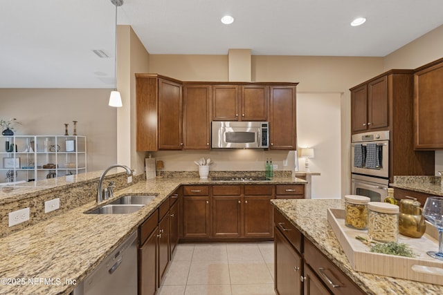 1100 Ashfield Way, Saint Johns, FL 32259 - kitchen with appliances with stainless steel finishes, light stone countertops, light tile patterned floors, and recessed lighting