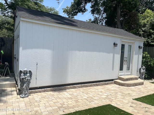 5713 Lake Lucina Dr N, Jacksonville, FL 32211 - exterior space with french doors, roof with shingles, and an outbuilding
