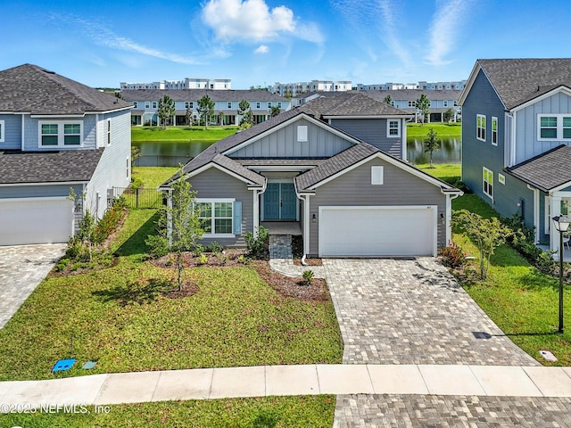 63 Goldcrest Way, Saint Augustine, FL 32092 - view of front of property with board and batten siding, a residential view, a water view, and driveway