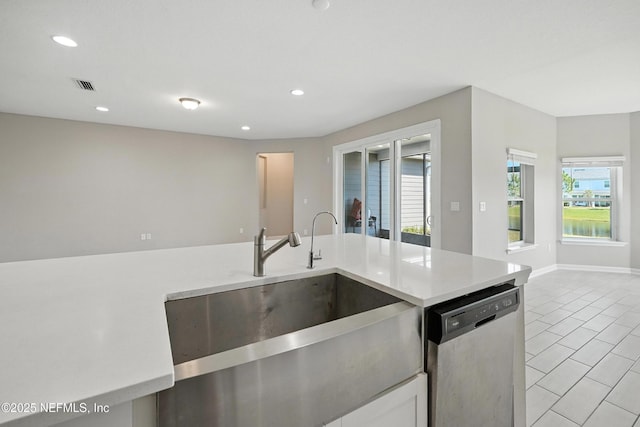 63 Goldcrest Way, Saint Augustine, FL 32092 - kitchen featuring stainless steel dishwasher, light tile patterned floors, plenty of natural light, light countertops, and recessed lighting