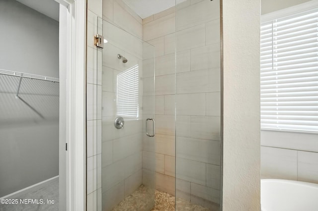 63 Goldcrest Way, Saint Augustine, FL 32092 - bathroom with a stall shower, a spacious closet, and a bathtub