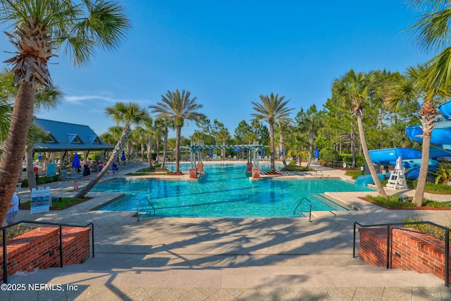 147 Rawlings Dr, Saint Johns, FL 32259 - community pool featuring a water slide and a patio area