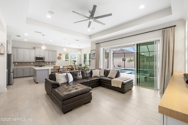 147 Rawlings Dr, Saint Johns, FL 32259 - living room featuring a ceiling fan, a raised ceiling, and recessed lighting