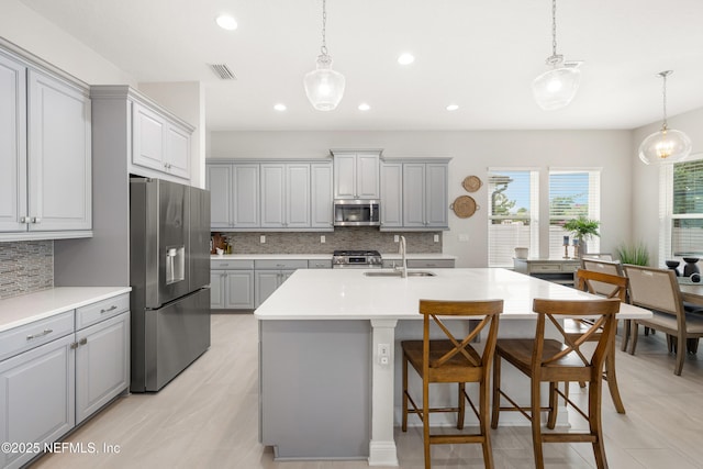 147 Rawlings Dr, Saint Johns, FL 32259 - kitchen featuring gray cabinetry, stainless steel appliances, backsplash, recessed lighting, and light countertops