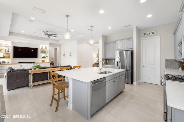 147 Rawlings Dr, Saint Johns, FL 32259 - kitchen featuring stainless steel appliances, gray cabinets, a ceiling fan, light countertops, and recessed lighting