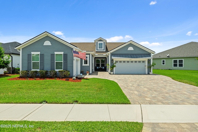 147 Rawlings Dr, Saint Johns, FL 32259 - view of front facade with an attached garage, decorative driveway, and a front lawn