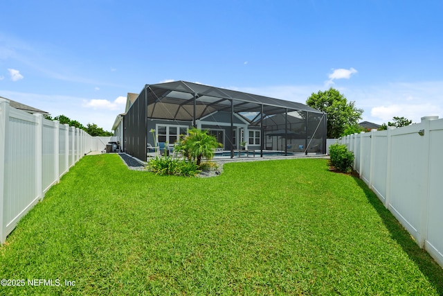 147 Rawlings Dr, Saint Johns, FL 32259 - rear view of property featuring a fenced backyard and glass enclosure