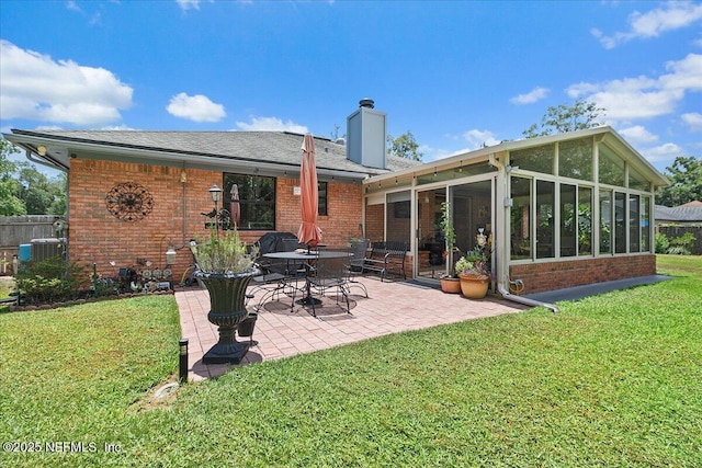 2282 Osceola Forest Ct, Fruit Cove, FL 32259 - rear view of property with brick siding, a sunroom, a chimney, and a patio area
